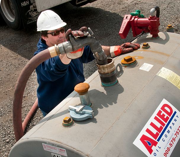 Allied Oil Technician Making Delivery